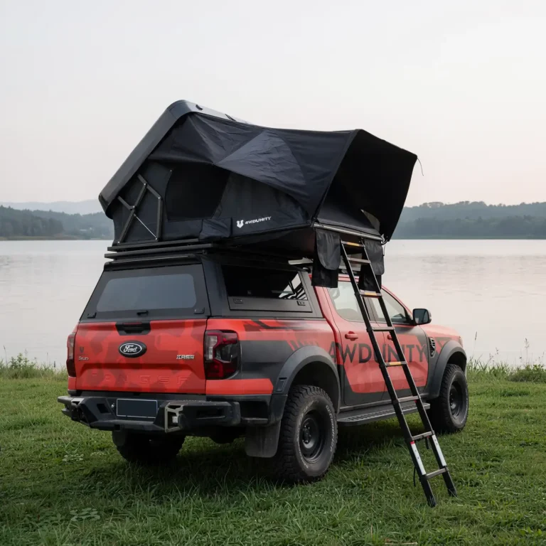 ABS Shell Roof Top Tent for camping, mounted on a vehicle.
