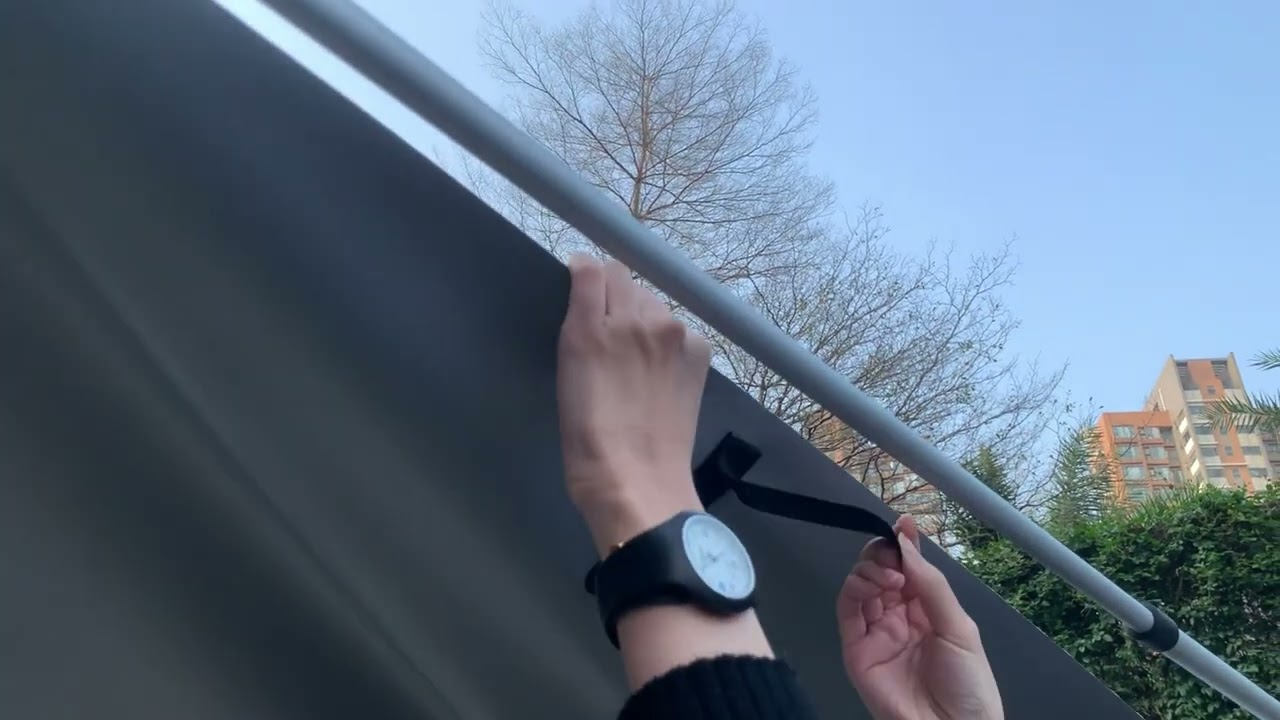 Vehicle side awning tent deployed on a 4WD